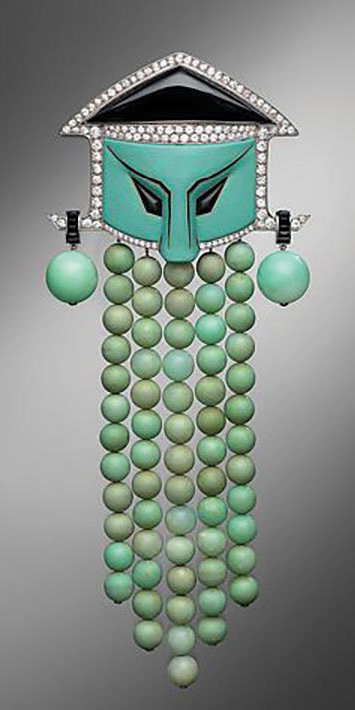 “Chinese Mask” dress ornament, jadeite, platinum, enamel, diamond and onyx by Georges Fouquet, ca. 1920-25, Metropolitan Museum, New York.