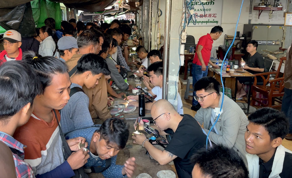 Packed in the market like sardines in a can, live-streaming broadcasters and Burmese dealers doing tremendous business. (Photo: Andrew Lucas. ©Guild Gemology Education)