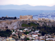 The International Gemmological Conference (IGC) View of the Acropolis of Athens from Mt Lycabettus as well as the Saronic Gulf; in the distance, the Peloponnese. (Photo: George E. Koronaios, Wikimedia Commons, CC BY-SA 4.0.